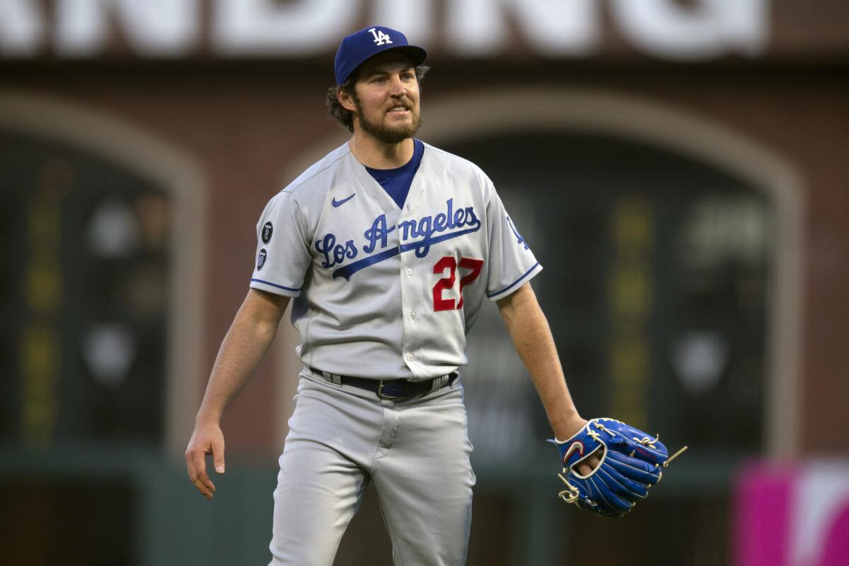 Dodgers right-hander Trebor Bauer reacts after a pitch against the San Francisco Giants.