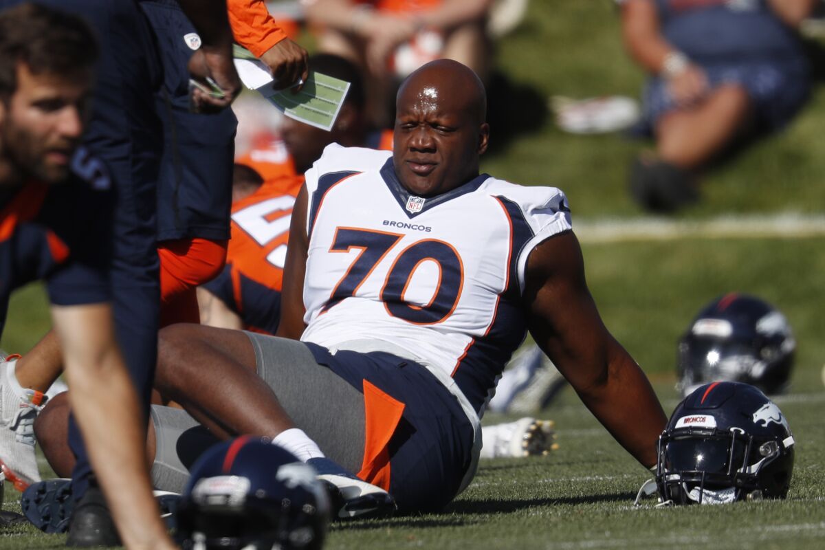 FILE - In this July 19, 2019, file photo, Denver Broncos offensive tackle Ja'Wuan James (70) stretches during NFL football training camp in Englewood, Colo. James informed the Broncos on Monday, Aug. 3, 2020, that he's opting out of the 2020 season over coronavirus concerns. (AP Photo/David Zalubowski, File)