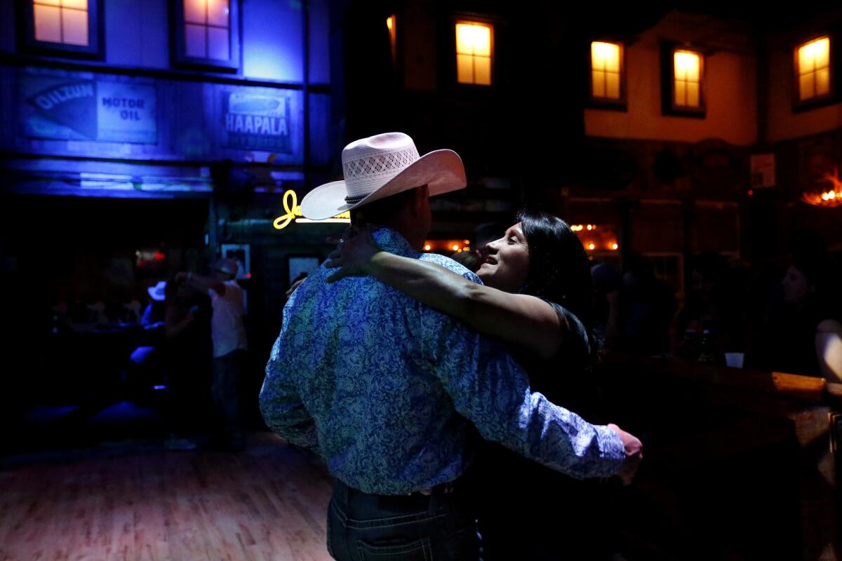Deedee Jozwika, right, of Houston, a full blooded Comanche Native American, dances with Jaylon Jacobson of Conroe at the Whiskey River Dance Hall and Saloon in Houston.