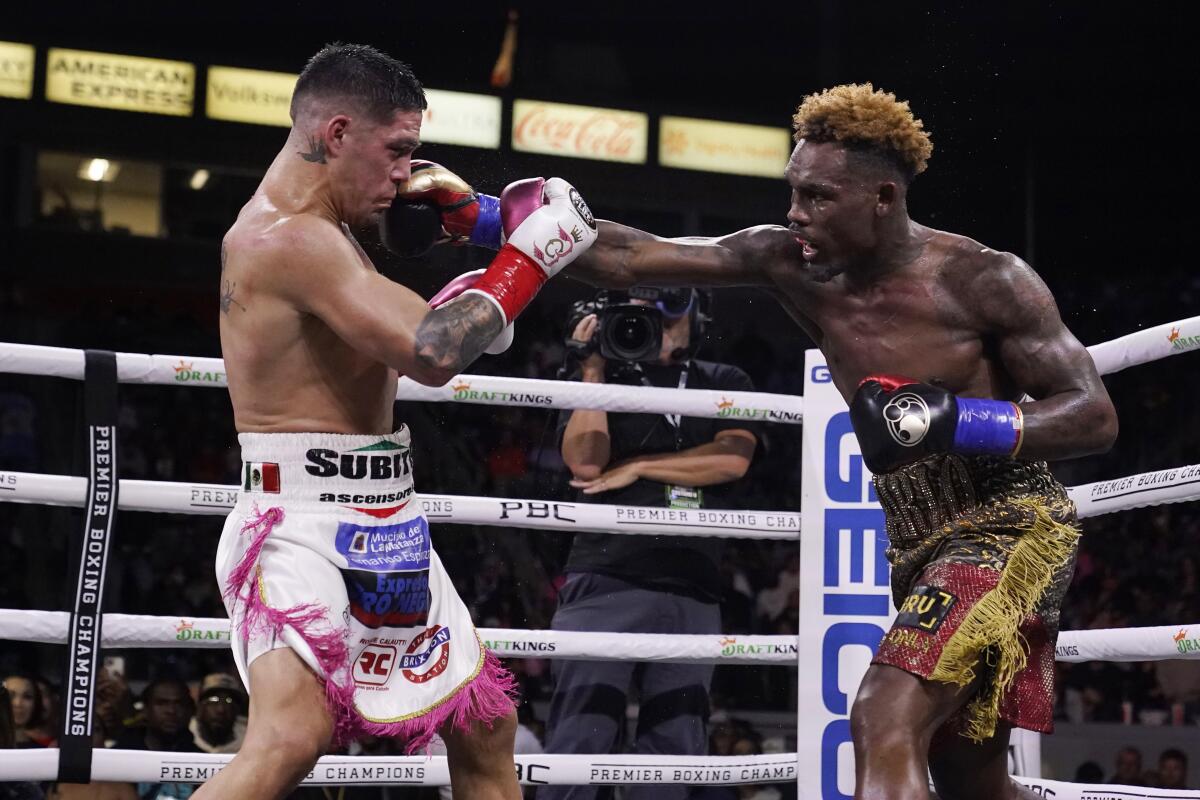 Jermell Charlo hits Brian Castano during a super welterweight boxing title bout on May 14, 2022, in Carson.