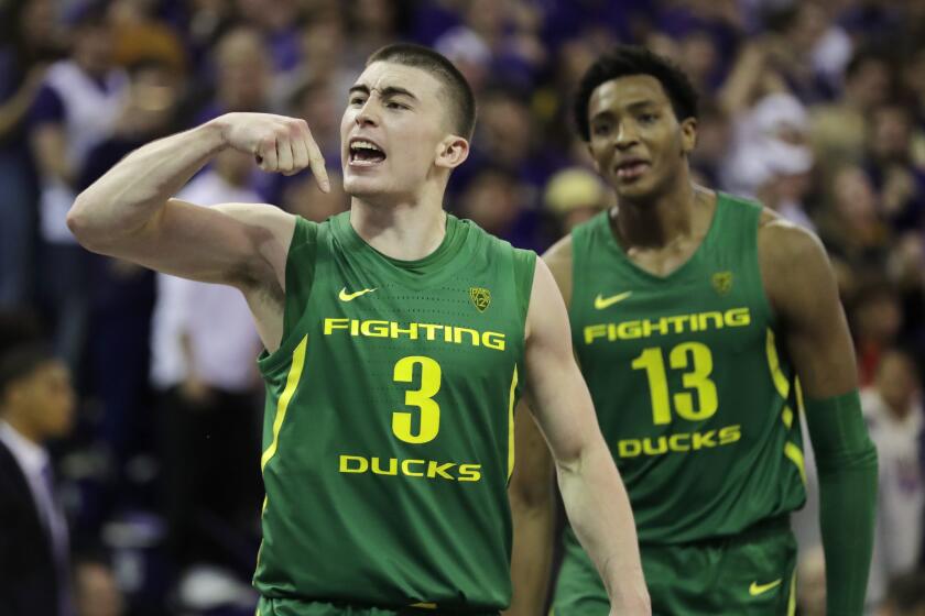 Oregon guard Payton Pritchard (3), reacts with forward Chandler Lawson (13) after Pritchard made the game-winning 3-point basket in overtime of an NCAA college basketball game against Washington, Saturday, Jan. 18, 2020, in Seattle. Oregon won 64-61 in overtime. (AP Photo/Ted S. Warren)