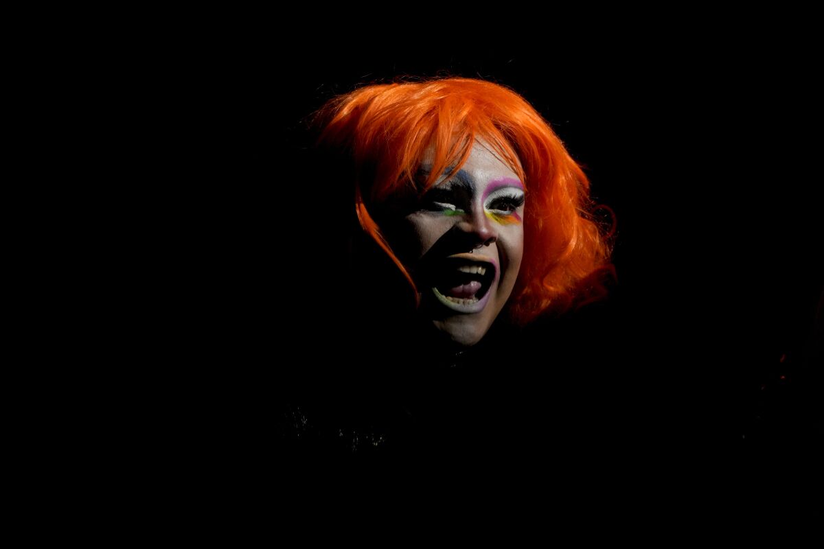 A person smiles during the annual Pride parade in Buenos Aires, Argentina, Saturday, Nov. 6, 2021. (AP Photo/Natacha Pisarenko)