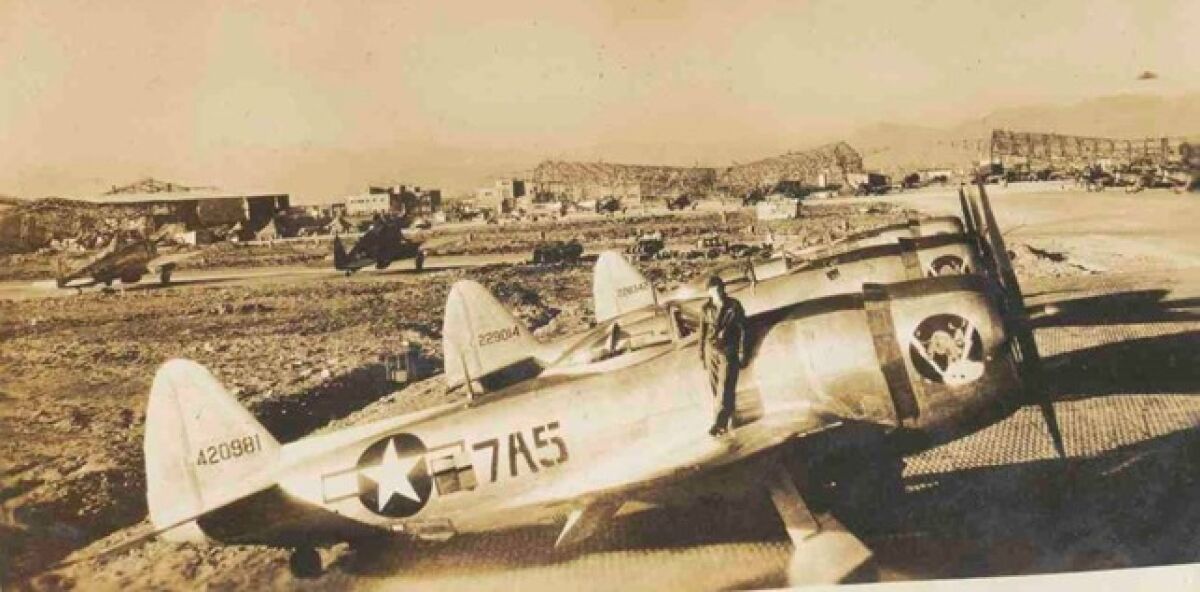 P-47 Thunderbolt planes lined up at an airport in Italy during World War II.  