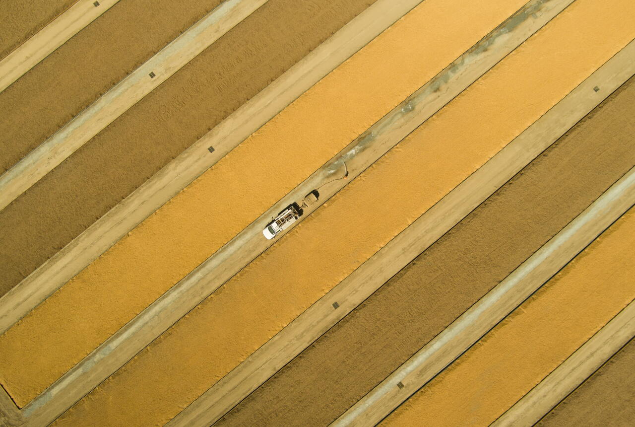 An overhead photo of a vehicle in a field.