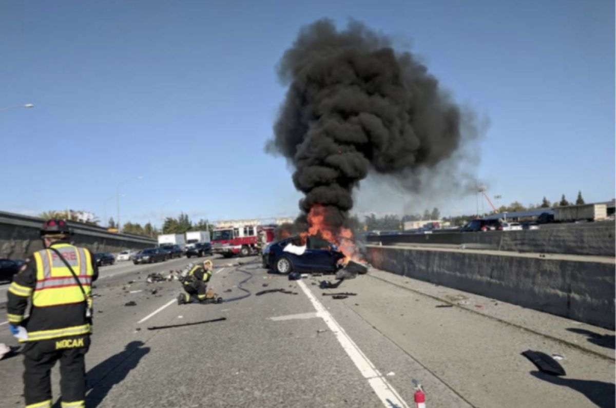 Smoke billows from a flaming battery after the Mountain View, Calif., Tesla crash in 2018.