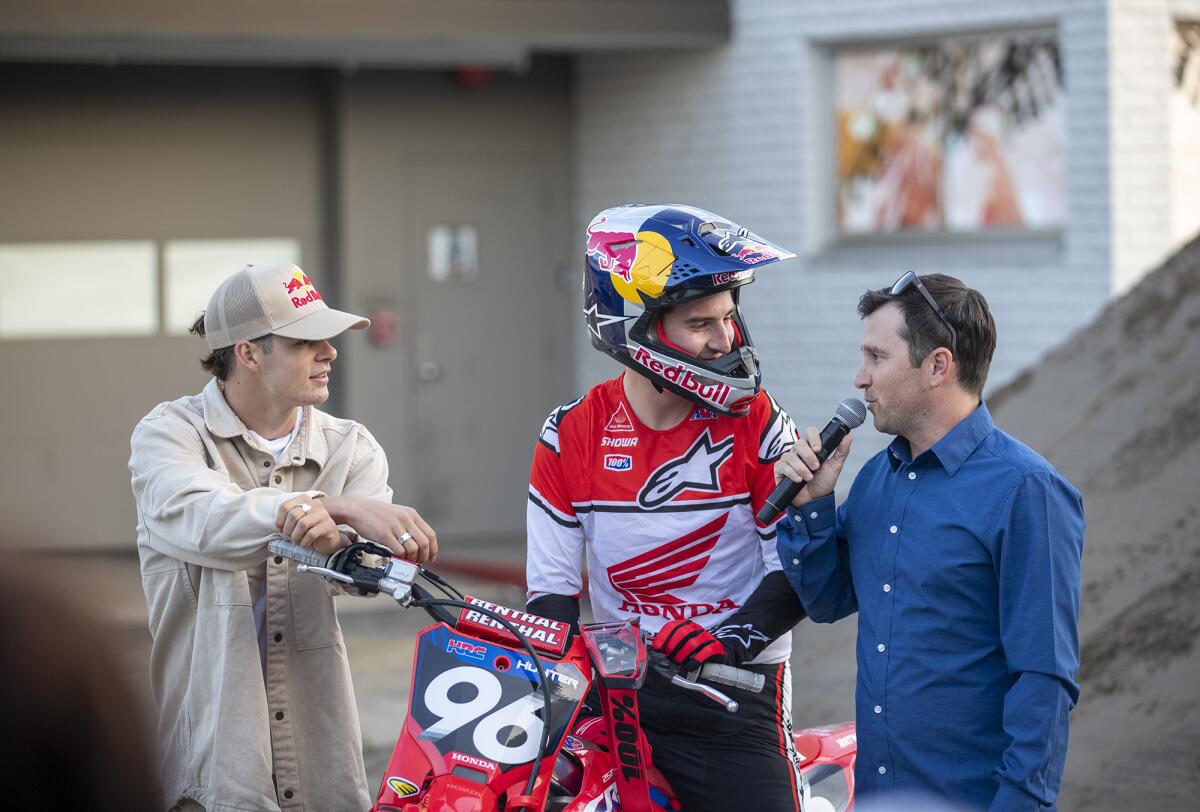 Motocross stars Jett, left, and Hunter Lawrence are interviewed by Daniel Blair at South Coast Plaza on Jan. 5.