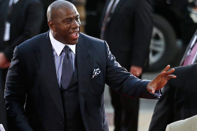 Former Lakers star Magic Johnson will set foot in the Forum on Sunday for the first time since the arena reopened in January.