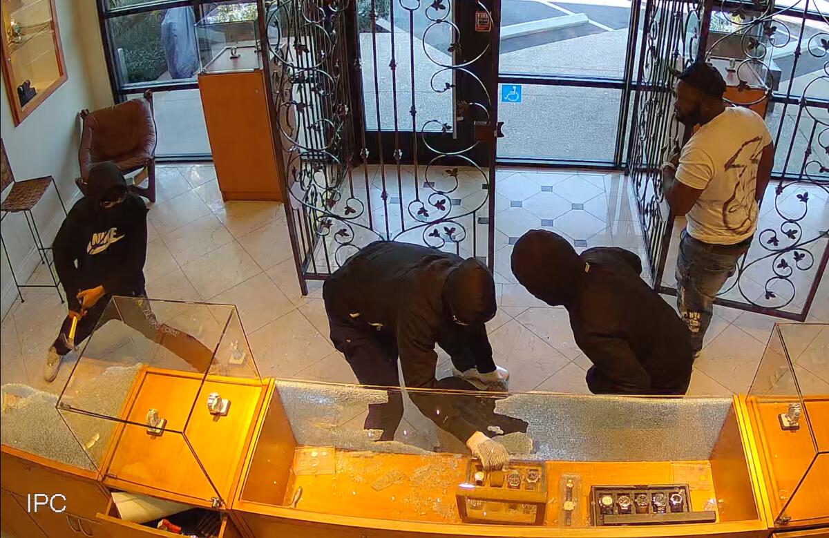 A screen grab shows the smash-and-grab robbery of $250,000 worth of watches stolen last week at a Newport Beach jeweler.