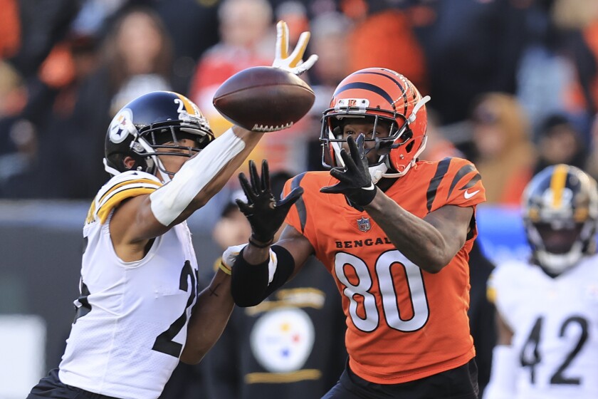Pittsburgh Steelers cornerback Ahkello Witherspoon (25) knocks a pass away from Cincinnati Bengals wide receiver Mike Thomas (80) during the second half of an NFL football game, Sunday, Nov. 28, 2021, in Cincinnati. (AP Photo/Aaron Doster)