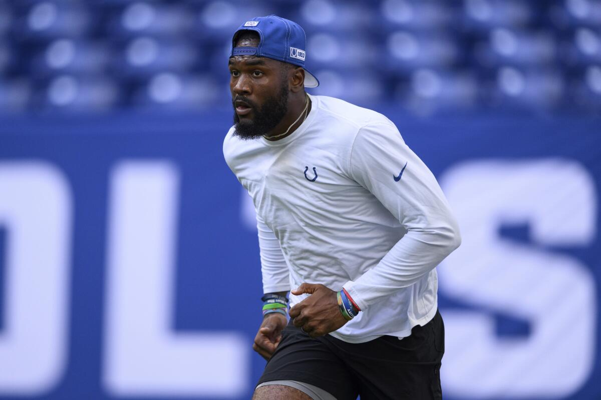 FILE - Indianapolis Colts linebacker Shaquille Leonard warms up before an NFL football game against the Tampa Bay Buccaneers on Aug. 27, 2022, in Indianapolis. Whether the three-time All-Pro will play Sunday at Houston remains a mystery. Leonard acknowledged Thursday, Sept. 8, 2022, that he's feeling better as he practices more though the Colts are playing it safe with one of their top play-makers heading into the season opener. (AP Photo/Zach Bolinger, File)