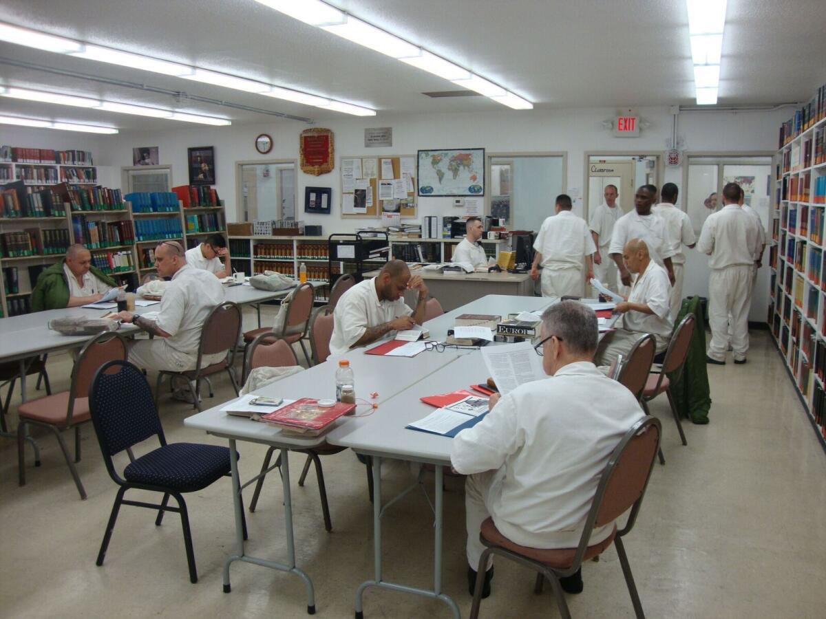 Students work in the seminary library at the state prison in Rosharon, Texas.