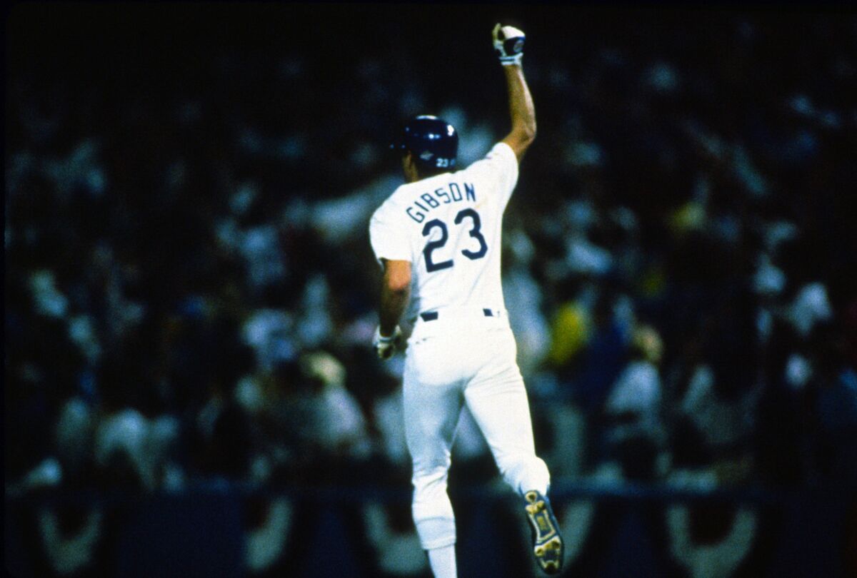 Kirk Gibson of the Los Angeles Dodgers celebrates as he trots his game-winning homer in 1988.
