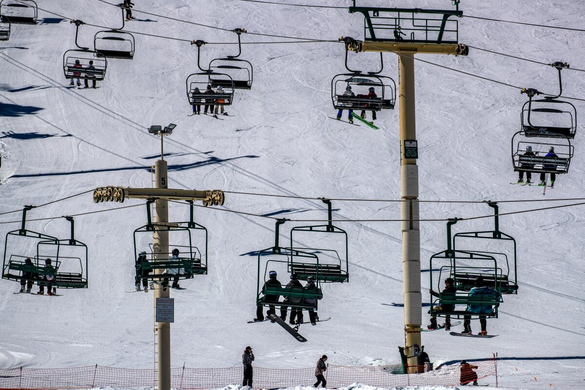 Skiers and snow boarders ascended upon Big Bear Mountain Resort on a sunny in March 2023 in Big Bear, CA. 