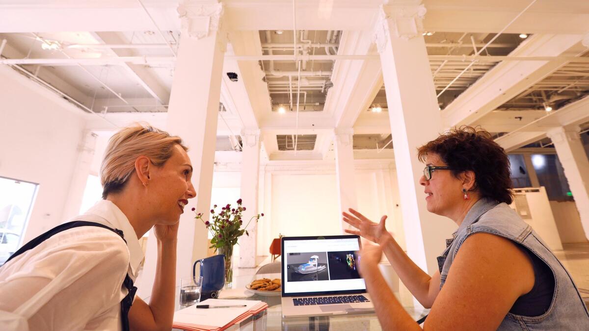 Cynthia Minet, right, discusses her art with Allison Agsten, director of the Main Museum under construction in downtown Los Angeles.