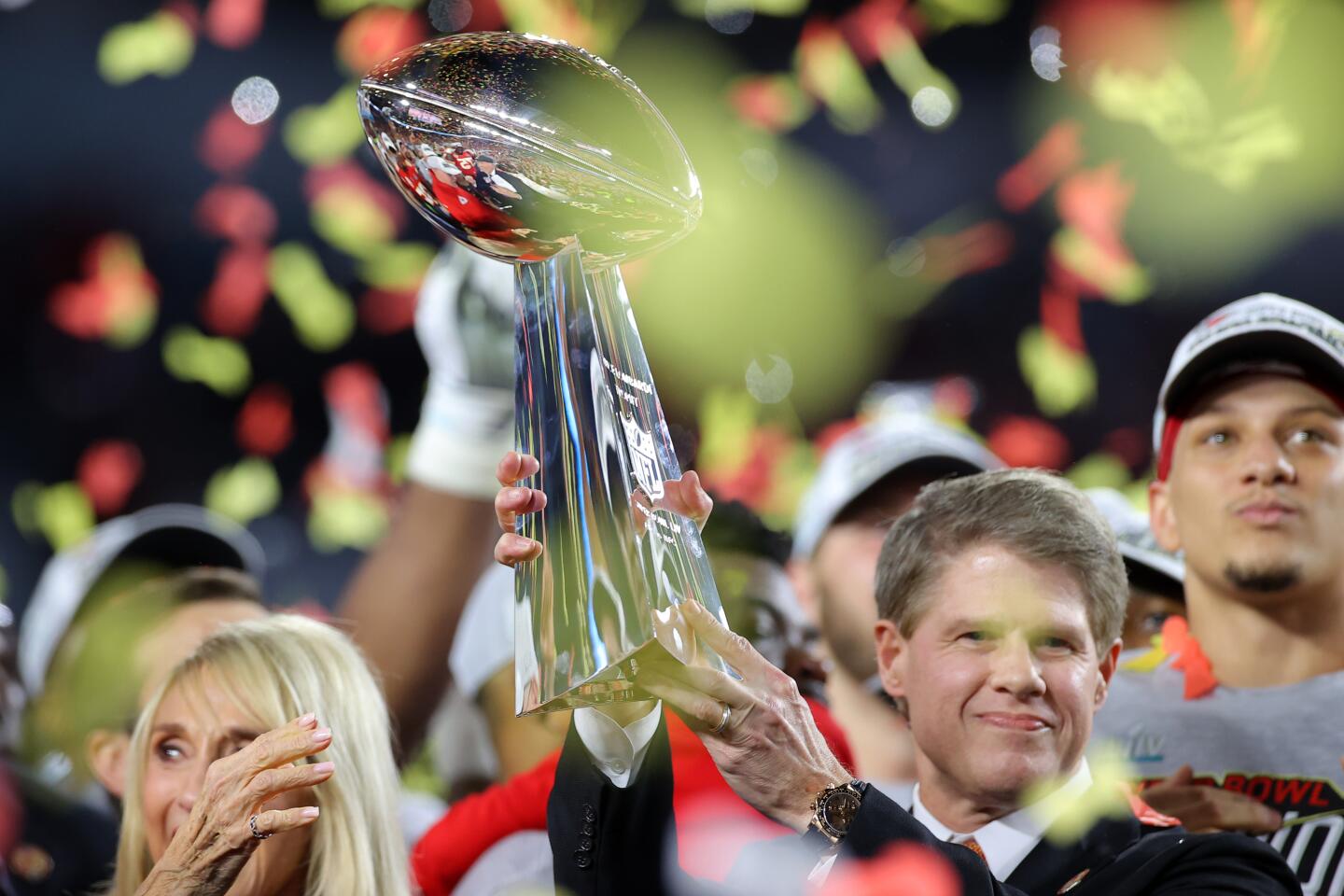 Kansas City Chiefs owner and CEO Clark Hunt raises the Vince Lombardi Trophy after the team's 31-20 victory over the San Francisco 49ers in Super Bowl LIV.
