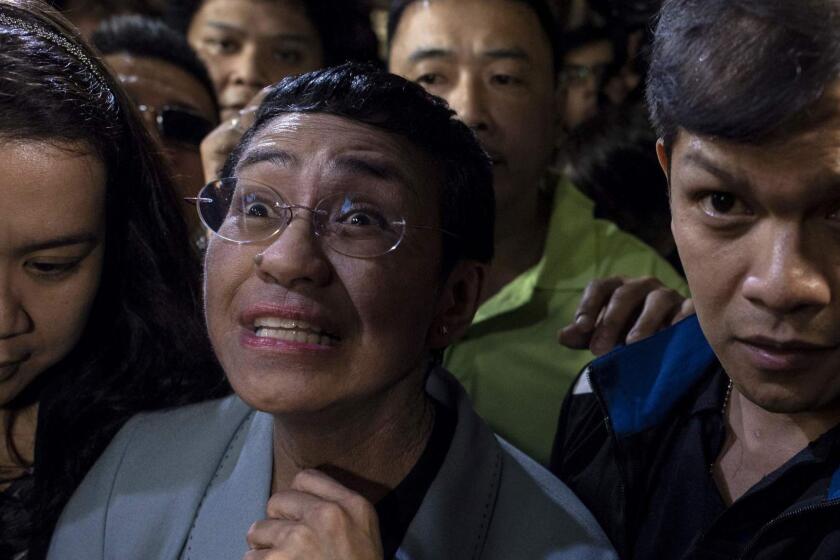 Philippine journalist Maria Ressa (C) arrives at a regional trial court in Manila to post bail on February 14, 2019. - Ressa was freed on bail on February 14 following an arrest that sparked international censure and allegations she is being targeted over her news site's criticism of President Rodrigo Duterte. (Photo by Noel CELIS / AFP)NOEL CELIS/AFP/Getty Images ** OUTS - ELSENT, FPG, CM - OUTS * NM, PH, VA if sourced by CT, LA or MoD **