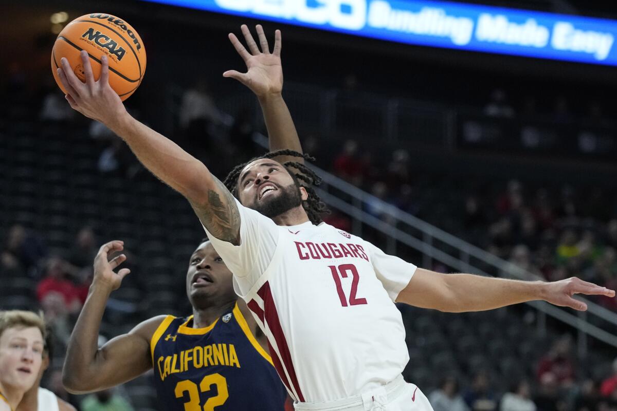 Washington State's Michael Flowers shoots around California's Jalen Celestine.