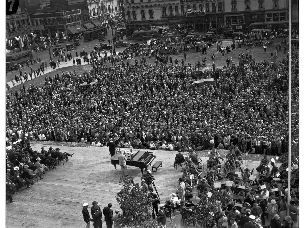 April 26, 1928: Stage and crowd at Los Angeles City Hall dedication ceremonies. In the left background is the corner of First and Main.