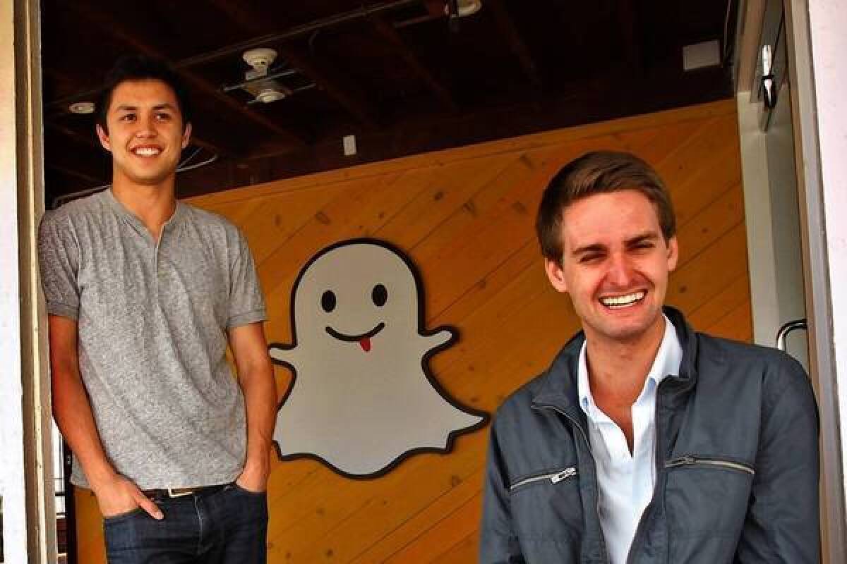 Snapchat co-founders Bobby Murphy, left, and Evan Spiegel have hired Instagram's Emily White to be Snapchat's chief operating officer.