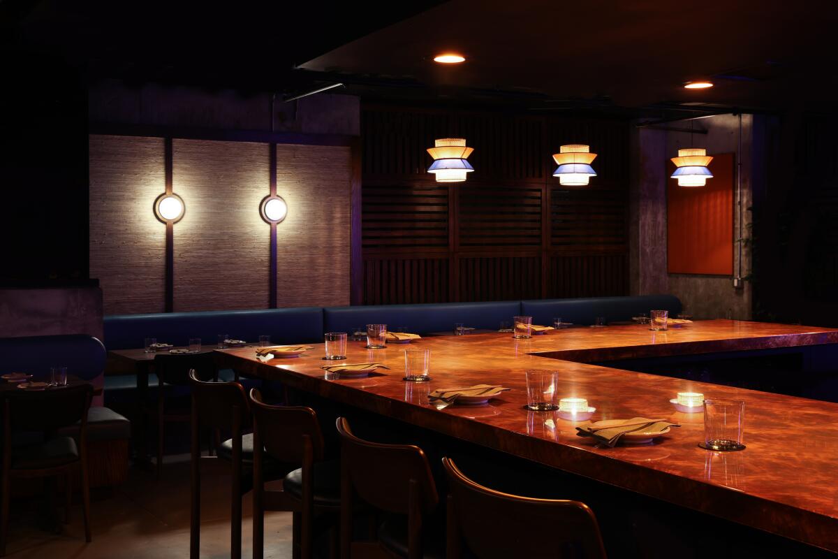 A dark interior of the bar and dining room of Budonoki