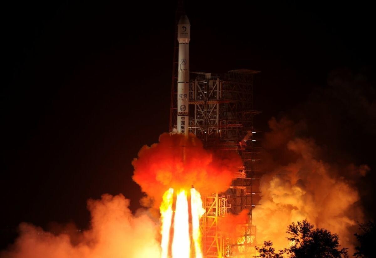 The Chang'e-3 rocket carrying the Jade Rabbit rover blasts off from the Xichang Satellite Launch Center in the southwest province of Sichuan, China.