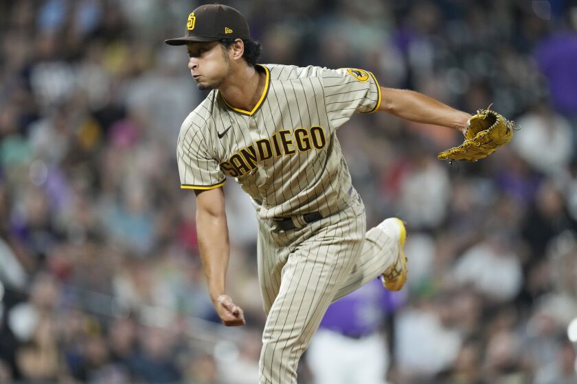 San Diego Padres starting pitcher Yu Darvish works against the Colorado Rockies in the sixth inning of a baseball game Saturday, Sept. 24, 2022, in Denver. (AP Photo/David Zalubowski)