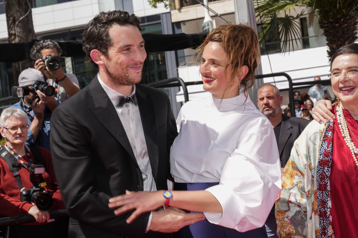 Josh O'Connor, left, and director Alice Rohrwacher pose for photographers upon arrival at the premiere of the film 'La Chimera' at the 76th international film festival, Cannes, southern France, Friday, May 26, 2023. (Photo by Scott Garfitt/Invision/AP)