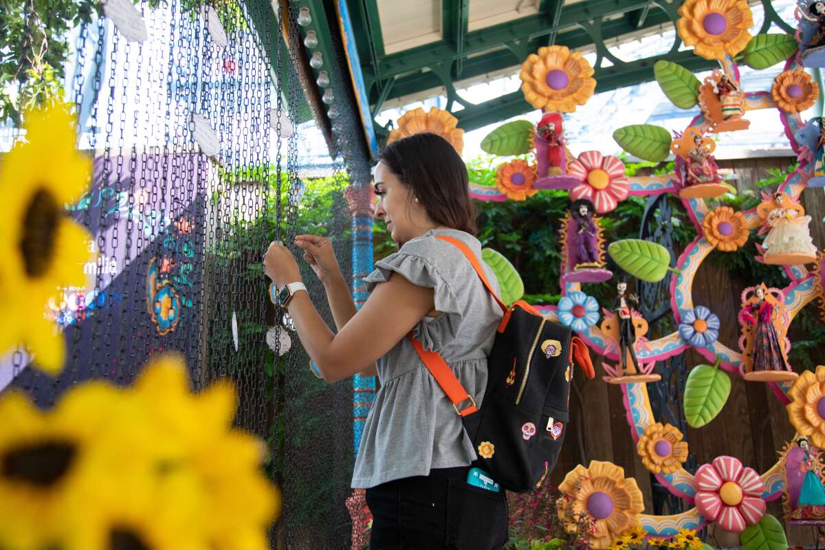 Plaza de la Familia guests are invited to add a remembrance note on the Memory Wall