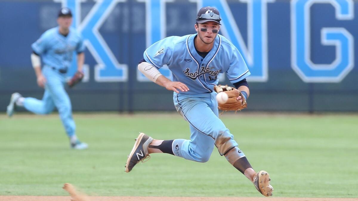 Corona del Mar High shortstop J.T. Schwartz runs down a short hopper in the second round of the CIF Southern Section Division 2 playoffs against Yucaipa on May 22.