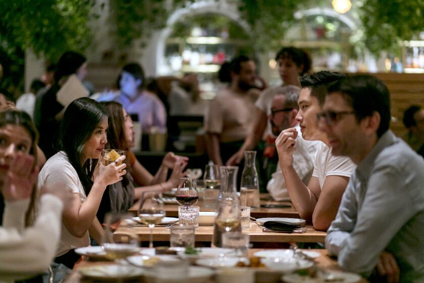 LOS ANGELES, CALIFORNIA - Oct. 18, 2019: Diners enjoy their diner at Bavel during a busy Friday night, Oct. 18, 2019, in Arts District in downtown Los Angeles. Bavel is the second restaurant from Bestia's husband-and-wife team chef Ori Menashe and pastry chef Genevieve Gergis. (Photo / Silvia Razgova) Assignment ID: 469636