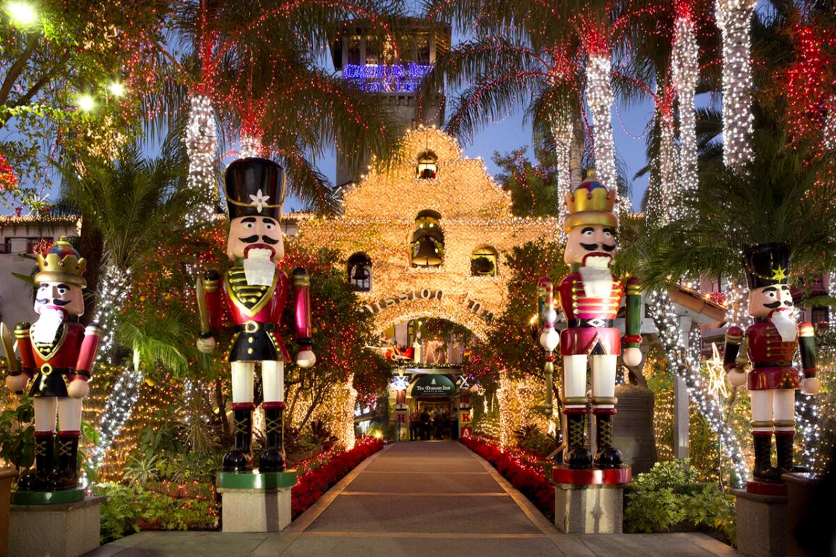 Exterior of Riverside's Mission Inn covered in Christmas decor.