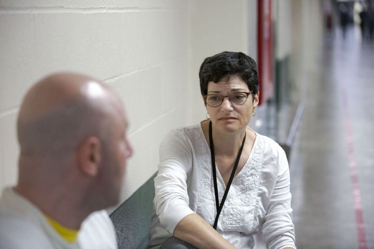 Erlick visits an inmate at the Men's Central Jail. (Liz Moughon / Los Angeles Times)
