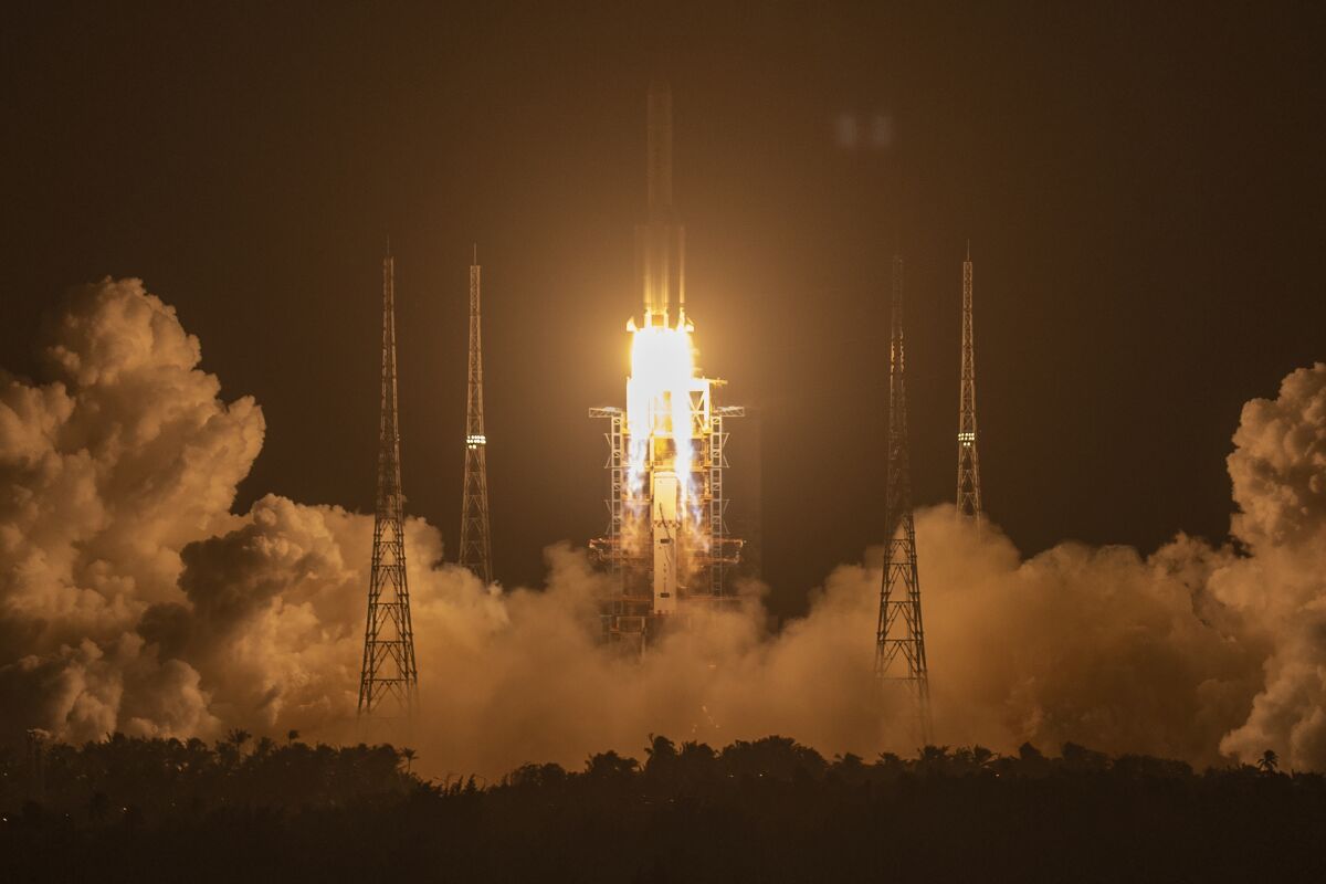 A Long March-5Y rocket carrying the Chang'e 5 lunar mission lifts off in Wenchang, China, early Tuesday.