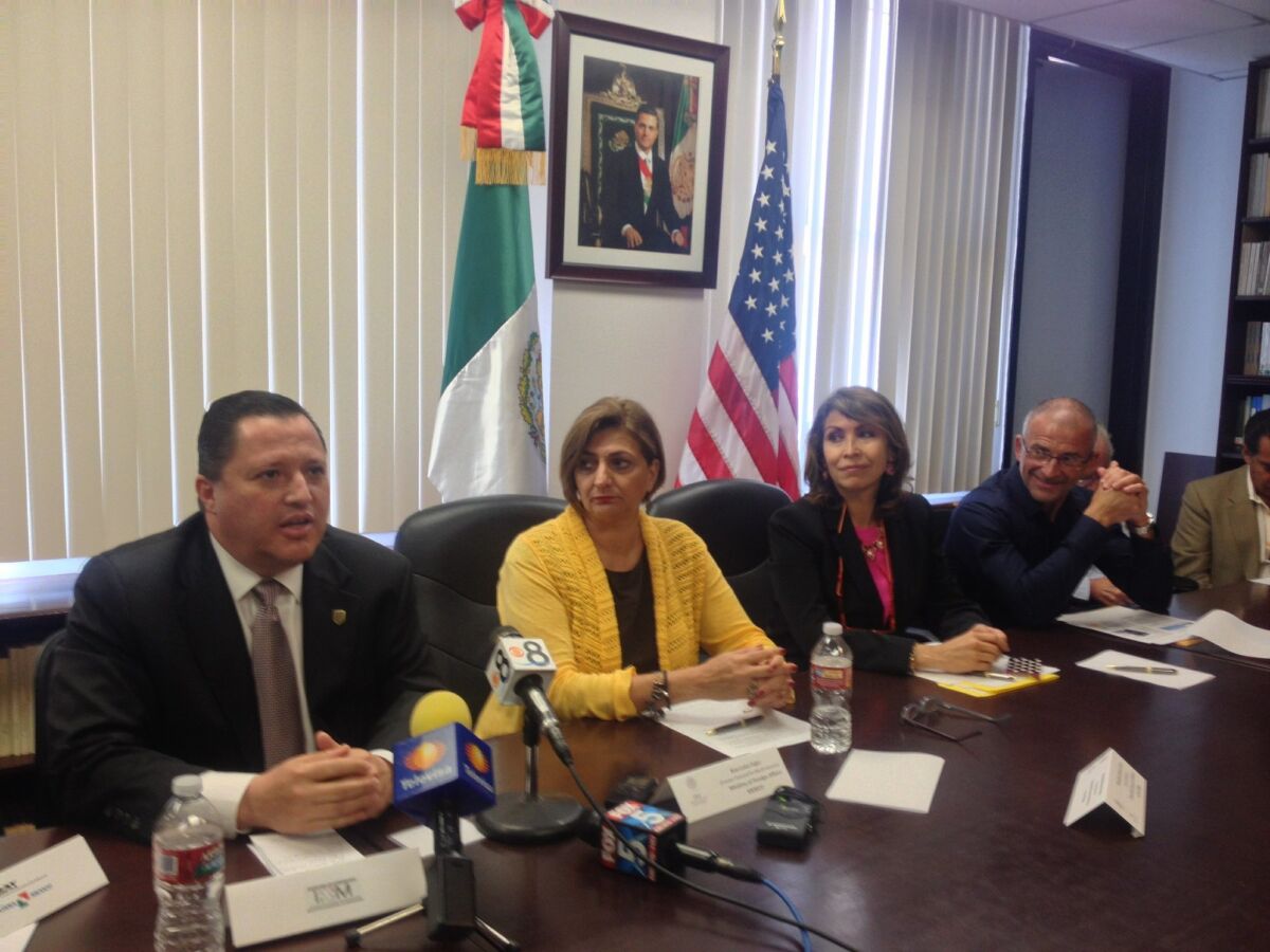 Rodulfo Figueroa, left, head of Mexico's federal immigration office in Baja California, during a news conference on Tuesday in San Diego to address Mexico's requirements for U.S. sportfishermen. At his side is Ana Luisa Fajer of Mexico's Foreign Ministry and Remedios Gomez Arnau, Mexico's Consul General in San Diego, and Alejandro Santander of the Mexican Tourism Board.