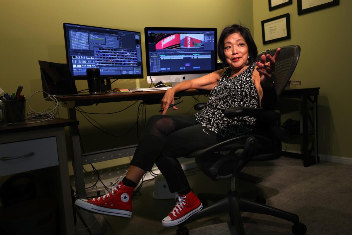 Omega Hsu sits at her editing bay