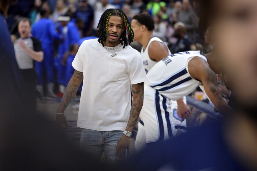 Memphis Grizzlies guard Ja Morant stands on the sideline before an NBA basketball game against the Dallas Mavericks, Monday, March 20, 2023, in Memphis, Tenn. (AP Photo/Brandon Dill)