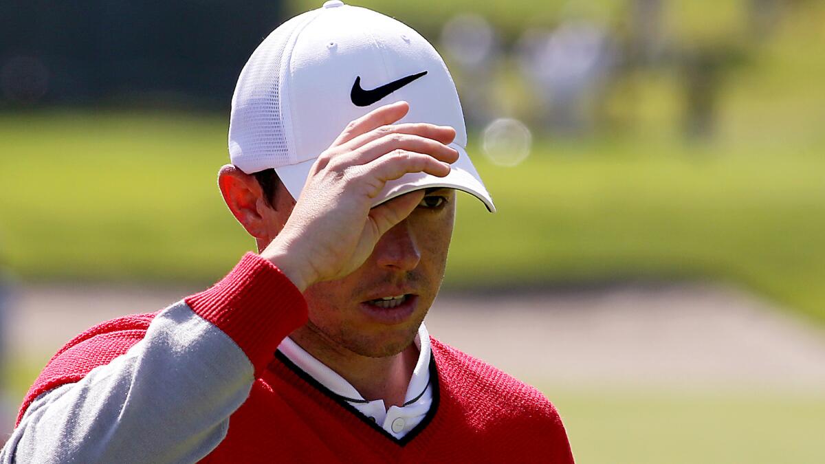 Rory McIlroy doffs his cap after finishing the first round of the Northern Trust Open golf tournament on Thursday at Riviera Country Club.