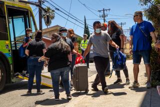 LOS ANGELES, CA - JULY 13: The group of migrants from Brownsville, Texas, arrive St. Anthony's Croatian Catholic Church on Thursday, July 13, 2023 in Los Angeles, CA. (Irfan Khan / Los Angeles Times)