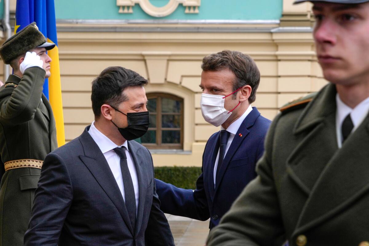 Ukrainian President Volodymyr Zelensky, left, and French President Emmanuel Macron.