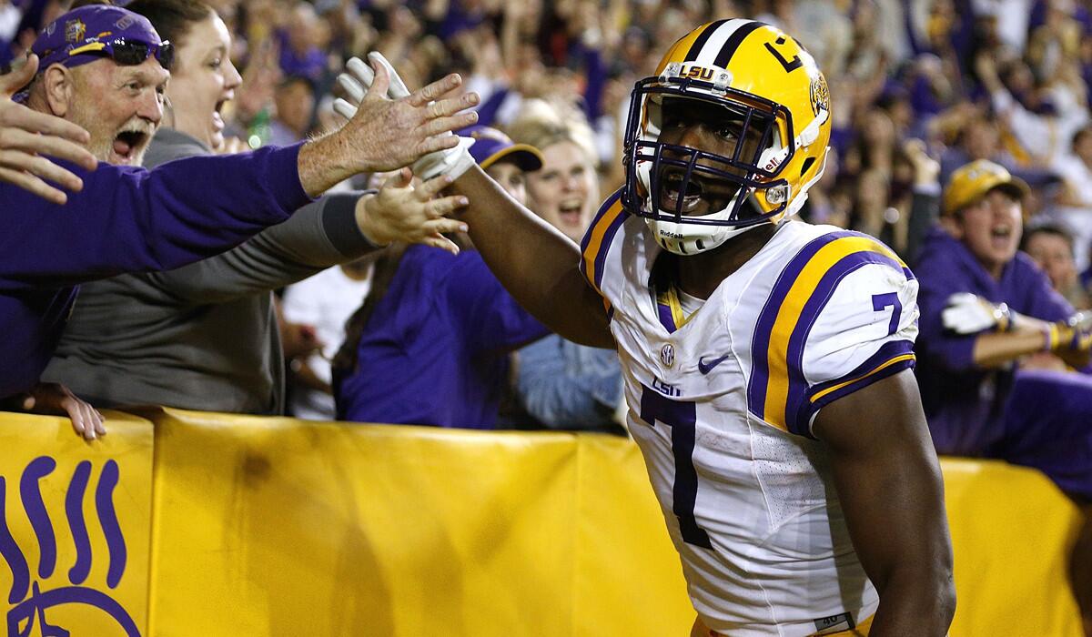 LSU's Leonard Fournette celebrates a 76-yard touchdown during the first half against Mississippi on Saturday.
