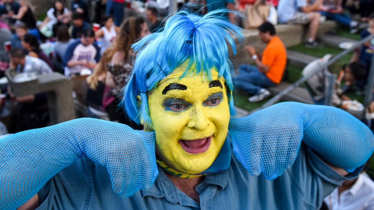 Elias Stimac wears a Flounder costume at opening at the Hollywood Bowl.