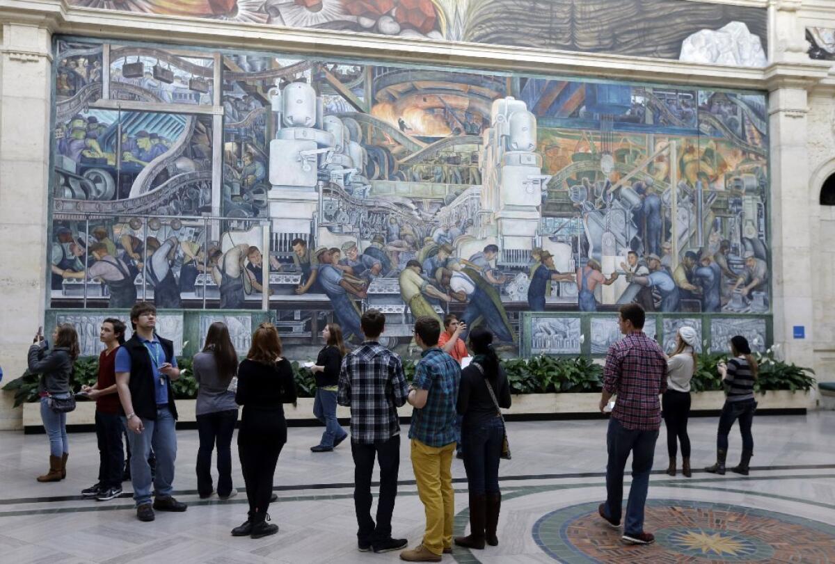 Museum-goers in front of a Diego Rivera mural at Detroit Institute of Arts. Foundations have promised $330 million to spare the city-owned museum from being forced to sell art to help satisfy debts in a municipal bankruptcy.