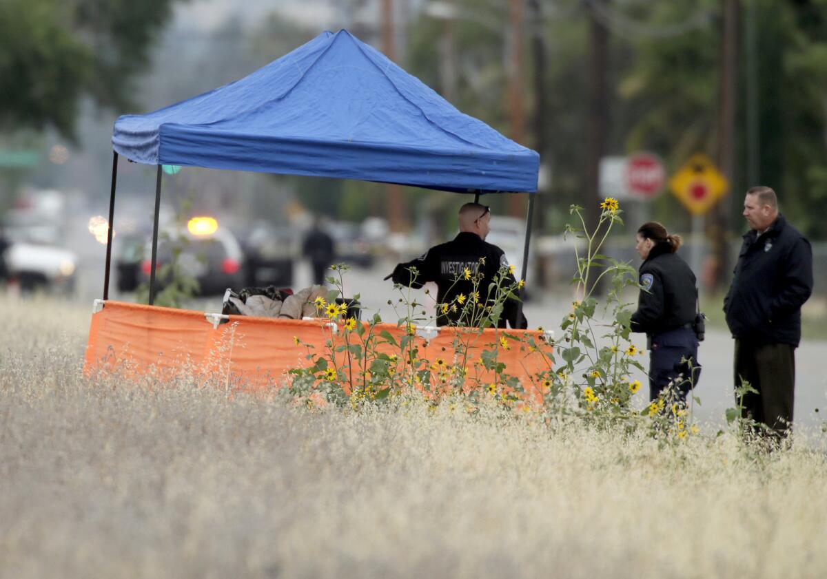 San Bernardino police investigate a body found at 6th Street and Sterling Avenue on Friday morning.