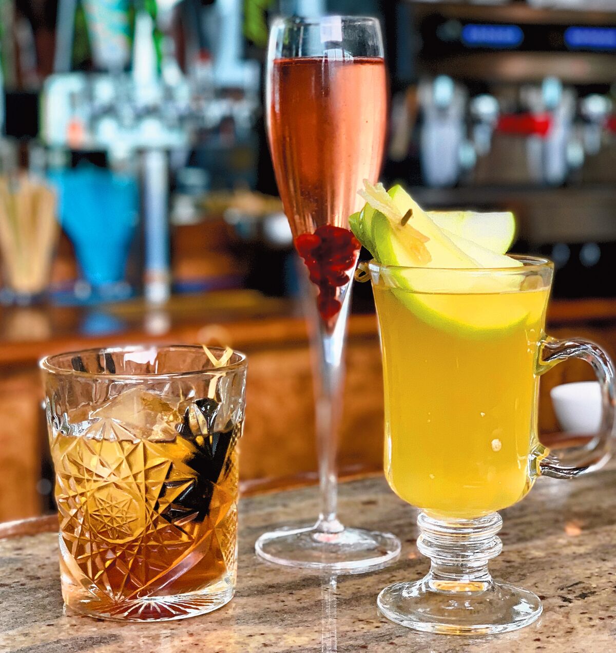 Some of the holiday drinks available at The Marine Room in La Jolla include the PB Old Fashioned, Holiday Sparkler, and Warm Gingered Apple.