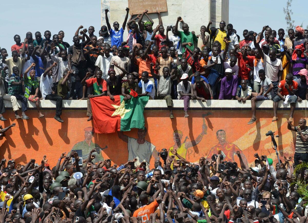 Residents of Burkina Faso's capital, Ouagadougou, celebrate after President Blaise Compaore announced that he was stepping down Oct. 31.
