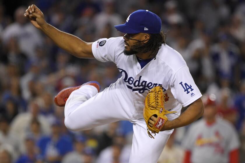 Los Angeles Dodgers relief pitcher Kenley Jansen watches a delivery during the ninth inning of the team's baseball game agains the St. Louis Cardinals on Tuesday, Aug. 6, 2019, in Los Angeles. (AP Photo/Mark J. Terrill)
