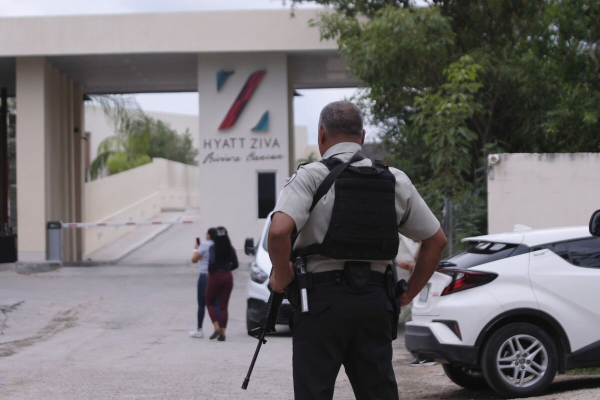 Government forces guard the entrance of hotel after an armed confrontation near Puerto Morelos, Mexico, Thursday, November 4, 2021. Two suspected drug dealers were killed after gunmen from competing gangs staged a dramatic shootout near upscale hotels that sent foreign tourists scrambling for cover. (AP Photo/Karim Torres)