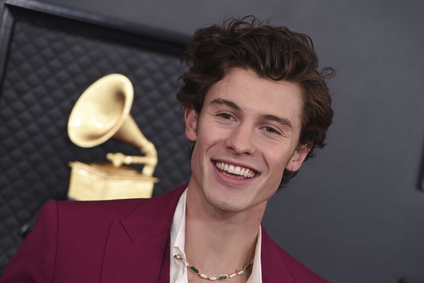 FILE - Shawn Mendes arrives at the 62nd annual Grammy Awards in Los Angeles, Jan. 26, 2020. Mendes has pulled the plug on the rest of his world tour, cancelling dates in North America and Europe so he can focus on his mental health, the singer-songwriter posted to social media Wednesday, July 27, 2022. (Photo by Jordan Strauss/Invision/AP, File)