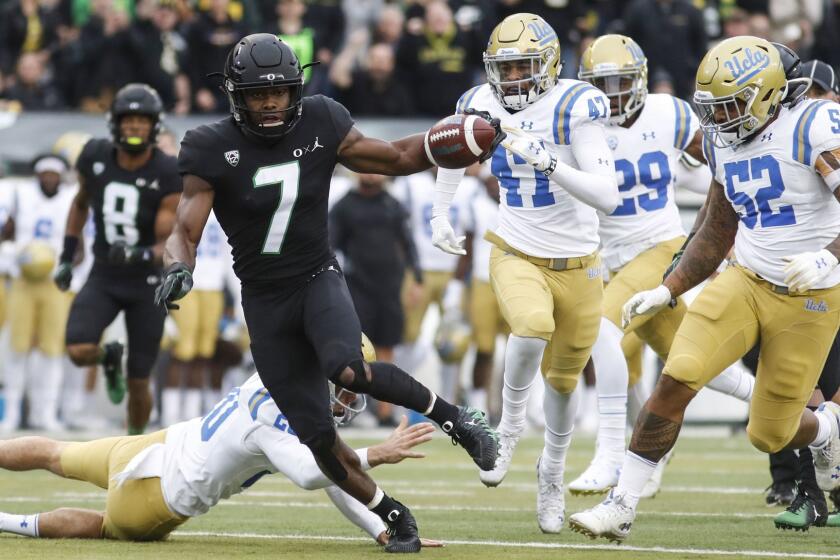 Oregon safety Ugochukwu Amadi (7), runs back a punt return for a touchdown against UCLA in the first quarter during an NCAA college football game in Eugene, Ore., Saturday, Nov. 3, 2018 (AP Photo/Thomas Boyd)