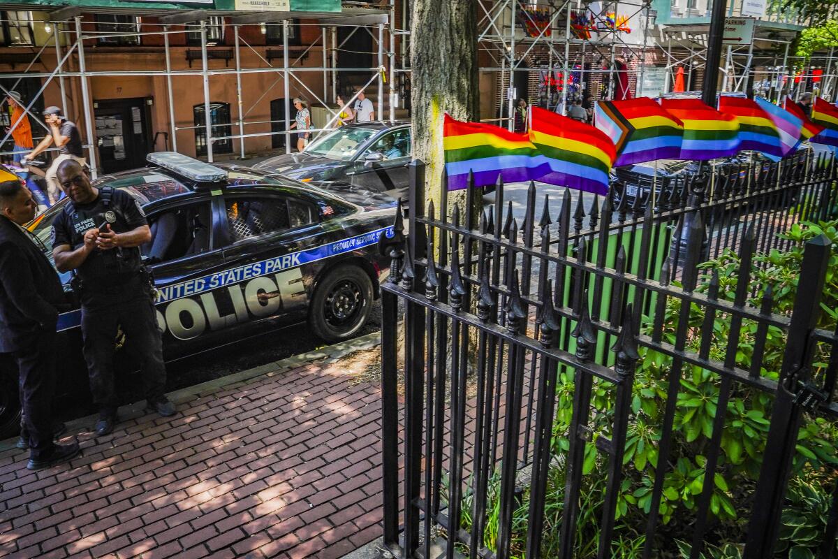 Pride flags on the railings of the Stonewall National Monument in New York